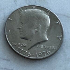 Four John F Kennedy Half Dollars